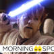 Ewan McGregor's Obi-Wan Kenobi in his tan robes holding his blue lightsaber aloft, ready to fight some battle droids.